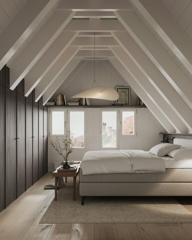 Spacious modern bedroom with a large pocket-sprung mattress and natural light from floor windows