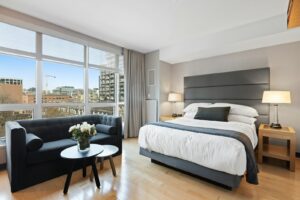 Neatly made luxury bed in a calm bedroom, illustrating common Hypnos mattress problems owners diagnose at home