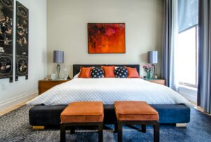 Neutral morning-light bedroom with a made bed, honest and reflective mood, representing a considered mattress verdict